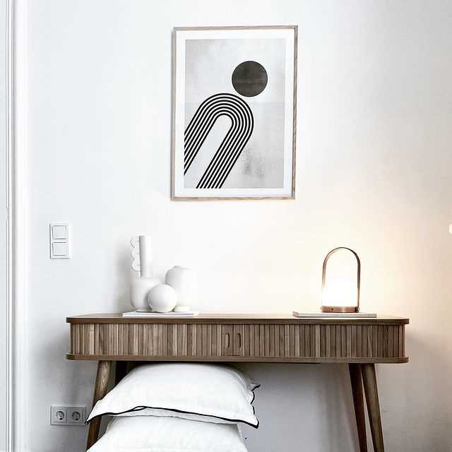 Combine posters with furniture